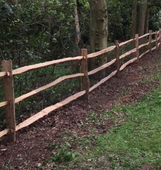 Image of a rustic cleft chestnut fence installed by Farm & Country Fencing, providing an attractive and eco-friendly boundary solution for any property.