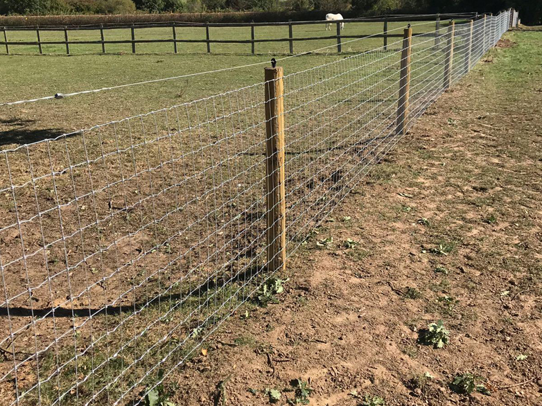 Tornado horse wire fence installation with electric strand