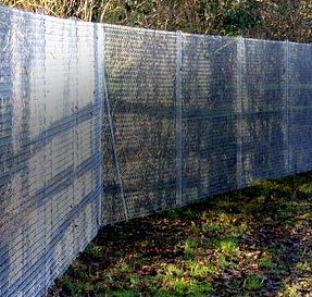 Galvanized durable chainlink fence installed by Farmyard & Fencing,  providing security for a commercial property.