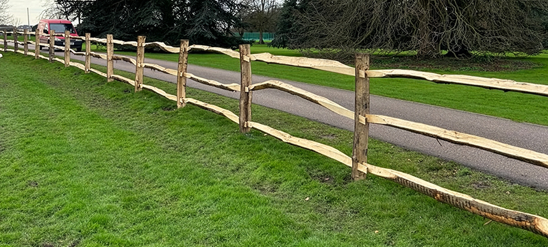 Traditional cleft chestnut fencing with barbed wire
