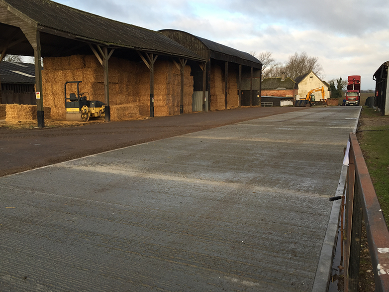 Completed concrete farm road with improved access to barns