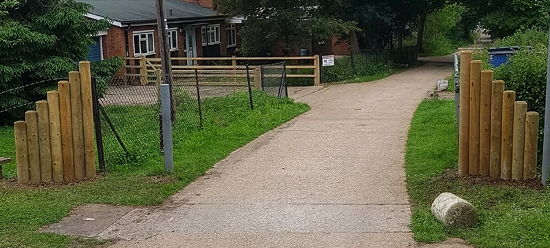 Simple demarcation fencing with round posts and back rail