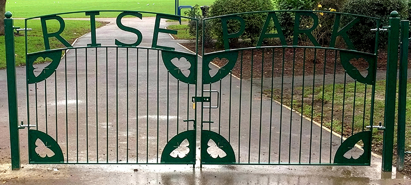Custom gates with laser cut butterfly design at Rise Park