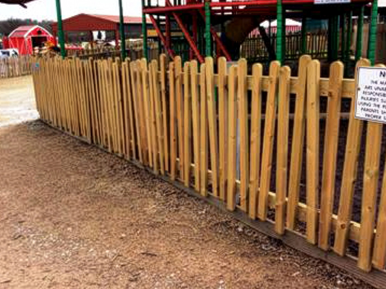 Close up of picket fence at farm park enclosure