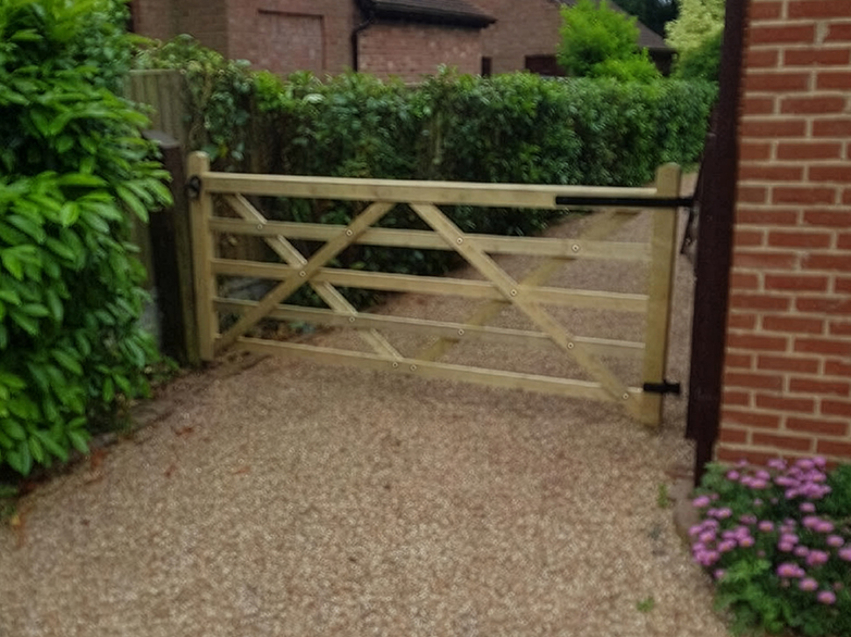 Timber field gate with black ironmongery installed at Wickford property