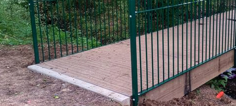 Footbridge repairs with metal railings and checker plate decking