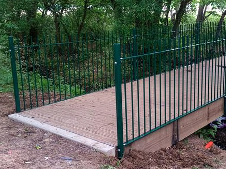 Footbridge with new vertical bar railings installed