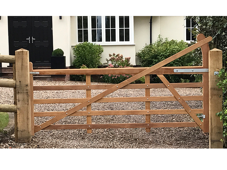 Pair of iroko hardwood gates with tapered finish