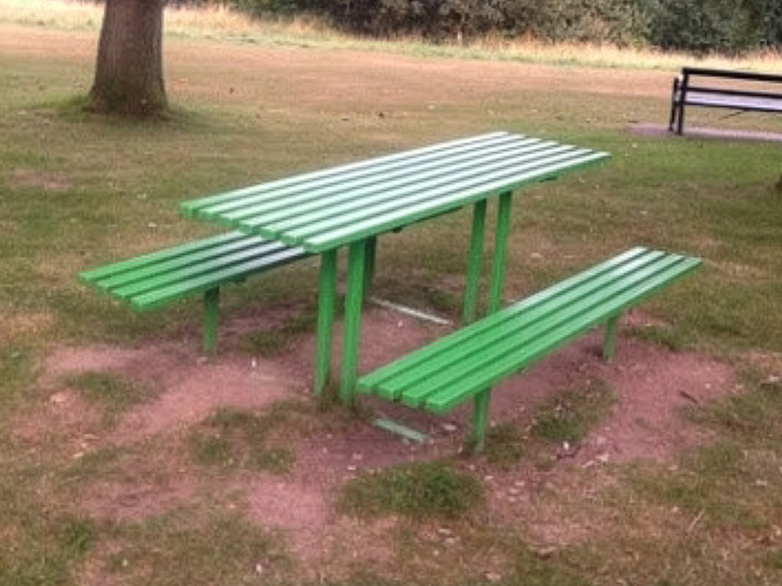 Damaged park benches and bins prepared for restoration