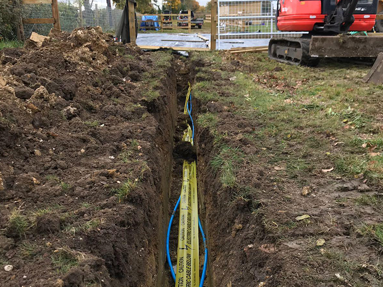 Trench for electric and drainage next to stable foundation