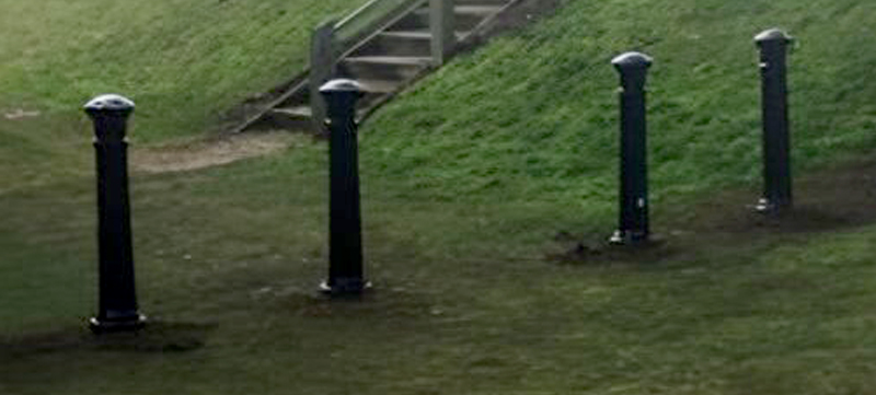 Cast iron bollards and hingeless barrier at council site