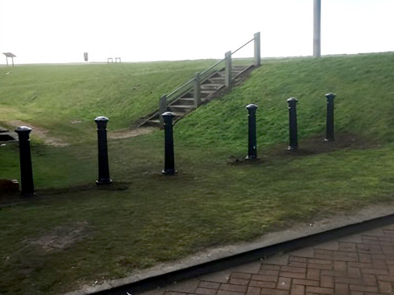 Installed cast iron bollards at car park perimeter