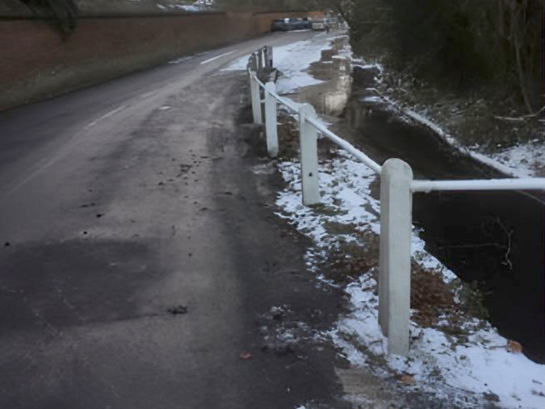 Concrete posts and bars being repaired in the snow