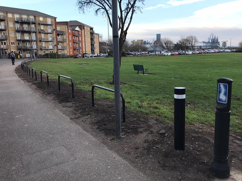 Hoop barriers spaced evenly across green public area