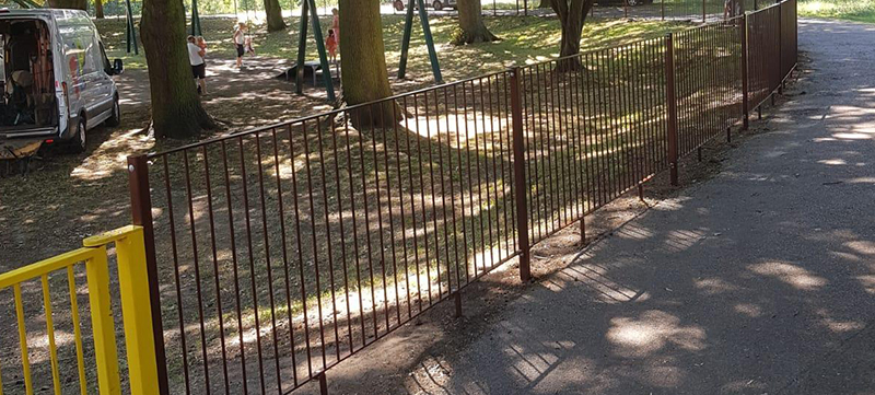 Powder-coated fencing around children's park area