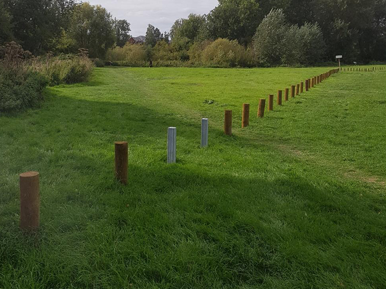 Timber Bollards Installed on Grass Verge