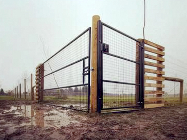 Secure access gate installed for enclosed dog walking field