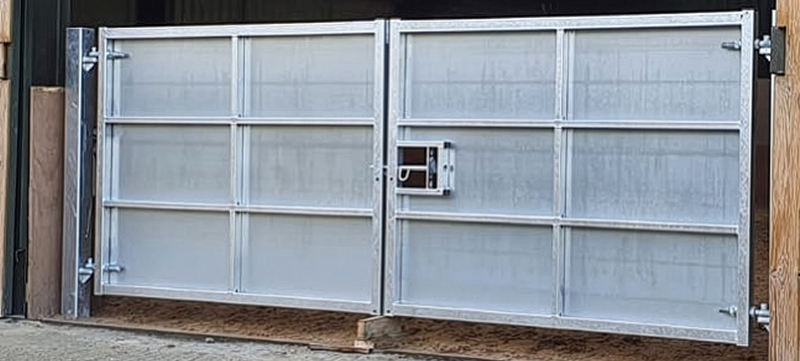 Sheeted gates installed at indoor riding school