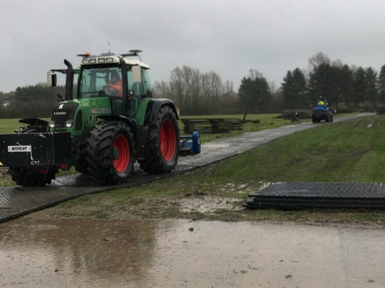 Trackway mats laid across grass to prevent ground damage
