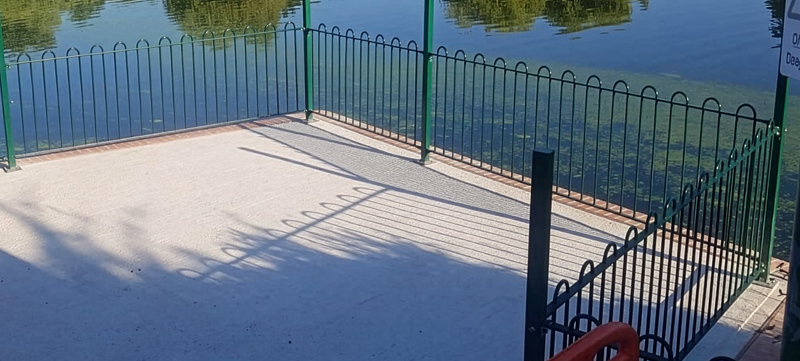 Bow top railings installed by lake edge at Harrow Lodge Park