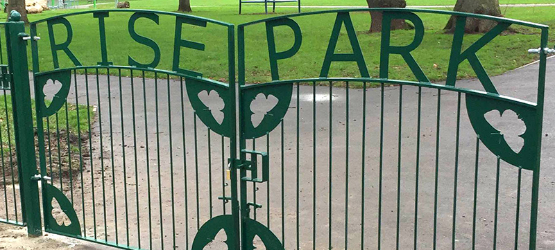 Custom metal gates with butterfly design at Rise Park