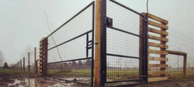 Secure fencing and entrance gate for dog field