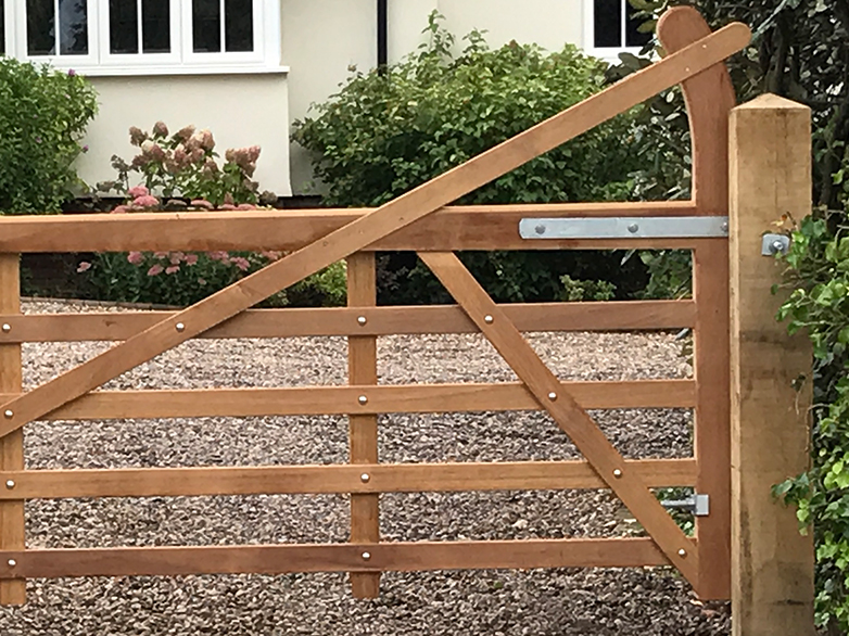 Finished hardwood entrance gates installed at property entrance