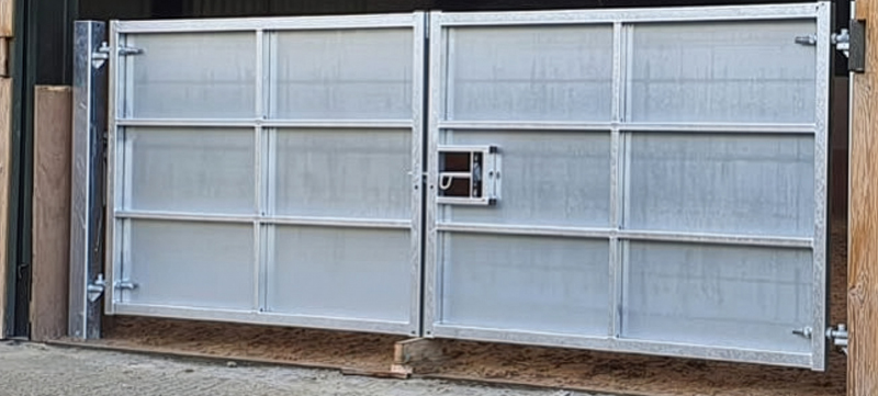 Sheeted metal gates installed for riding school