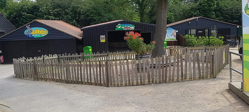 Wonky picket fence at Old MacDonalds Park Farm