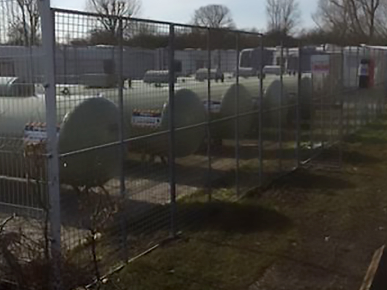 Security Fence Around Gas Storage Tank