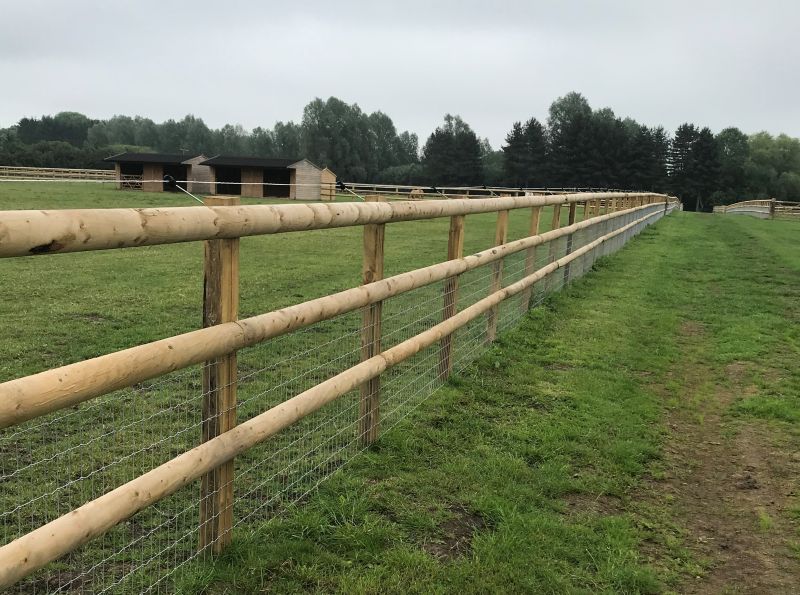 A sturdy and durable horse fence made of high-quality materials, erected by Farm & Country Fencing ensuring the safety and security of your equine companions.